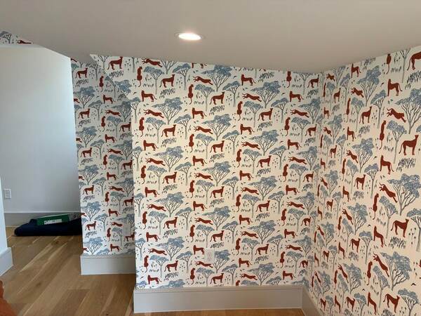 Safari animal nursery wallpaper with soft neutrals in a Waco kids room